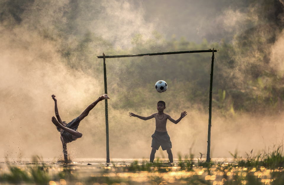 A player moving the ball during a local match